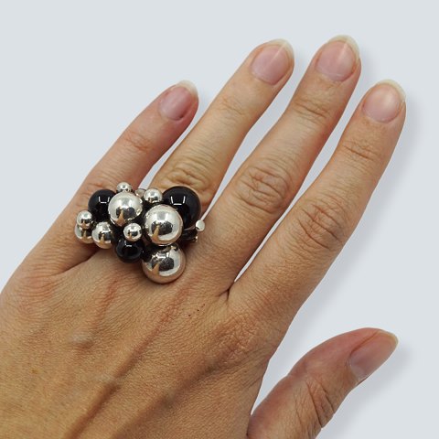 Georg Jensen; A Moonlight Grapes ring of sterling silver set with onyx Georg Jensen; A Moonlight Grapes ring of sterling silver set with onyx